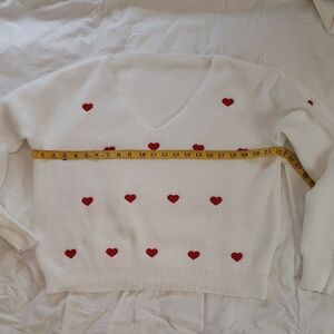 White Sweater with Red Heart Accents